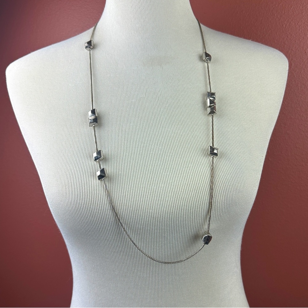 Long Diane Von Furstenberg silver tone necklace 36 inches stamped DVF
